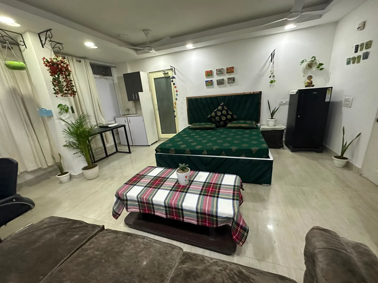 Bed with the pantry and fridge along the far wall